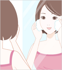鏡に向かって洗顔する女性